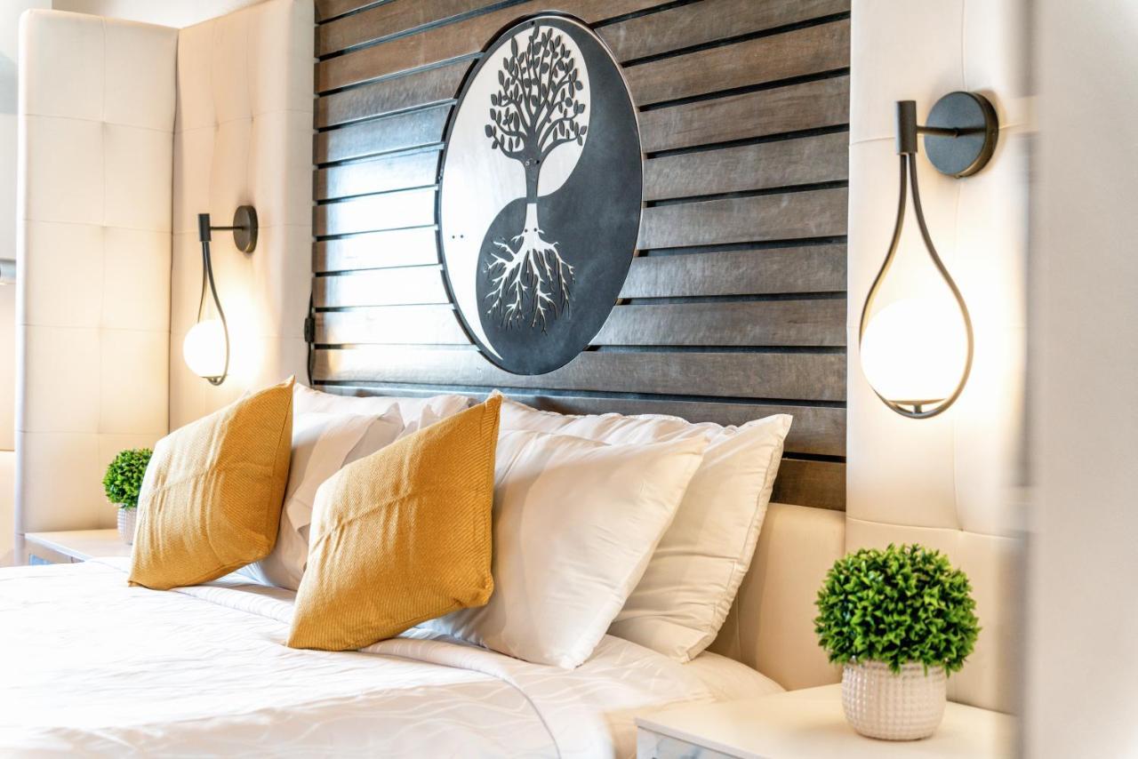 Aspire Inn Studios & Spas เบลฟลาวเวอร์ ภายนอก รูปภาพ